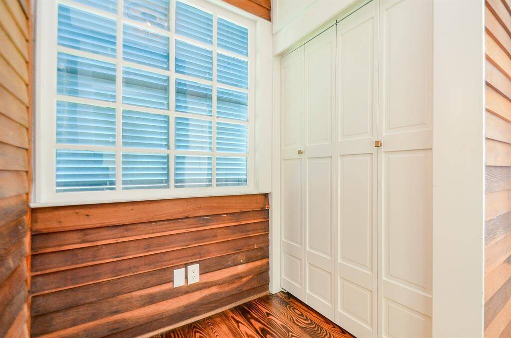 View of hallway located outside of the secondary bedroom with additional closet space & bifold doors.