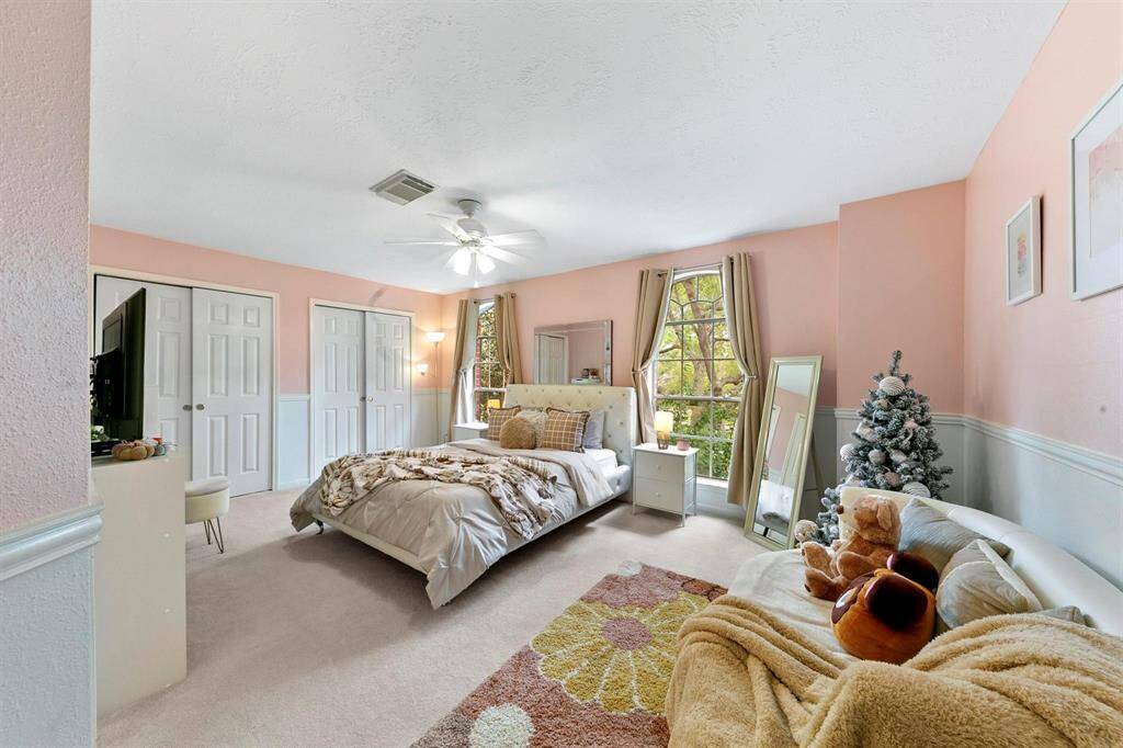 The spacious fourth secondary bedroom upstairs offers direct access to the additional Jack and Jill bathroom.