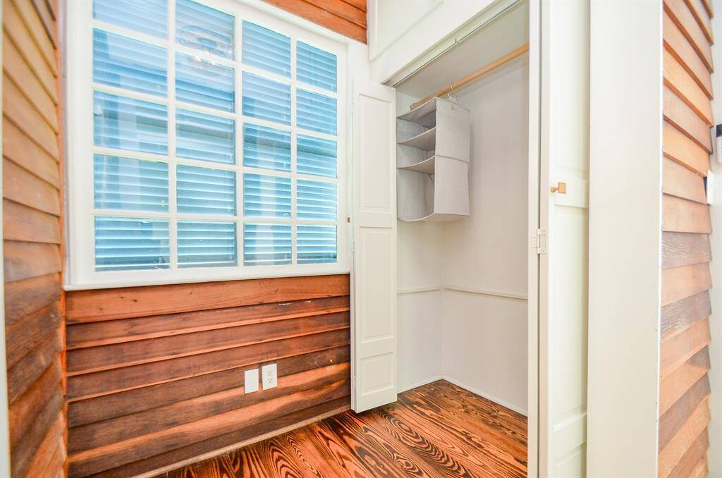 View of hallway located outside of the secondary bedroom with additional closet space & bifold doors.
