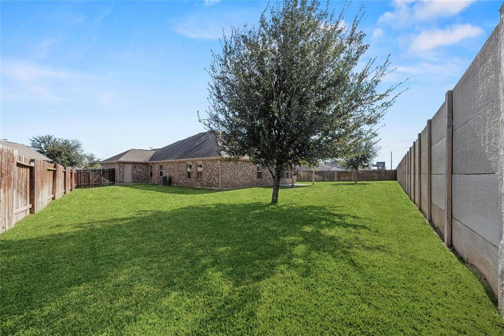 This home has direct access to the backyard from the 3 car garage.