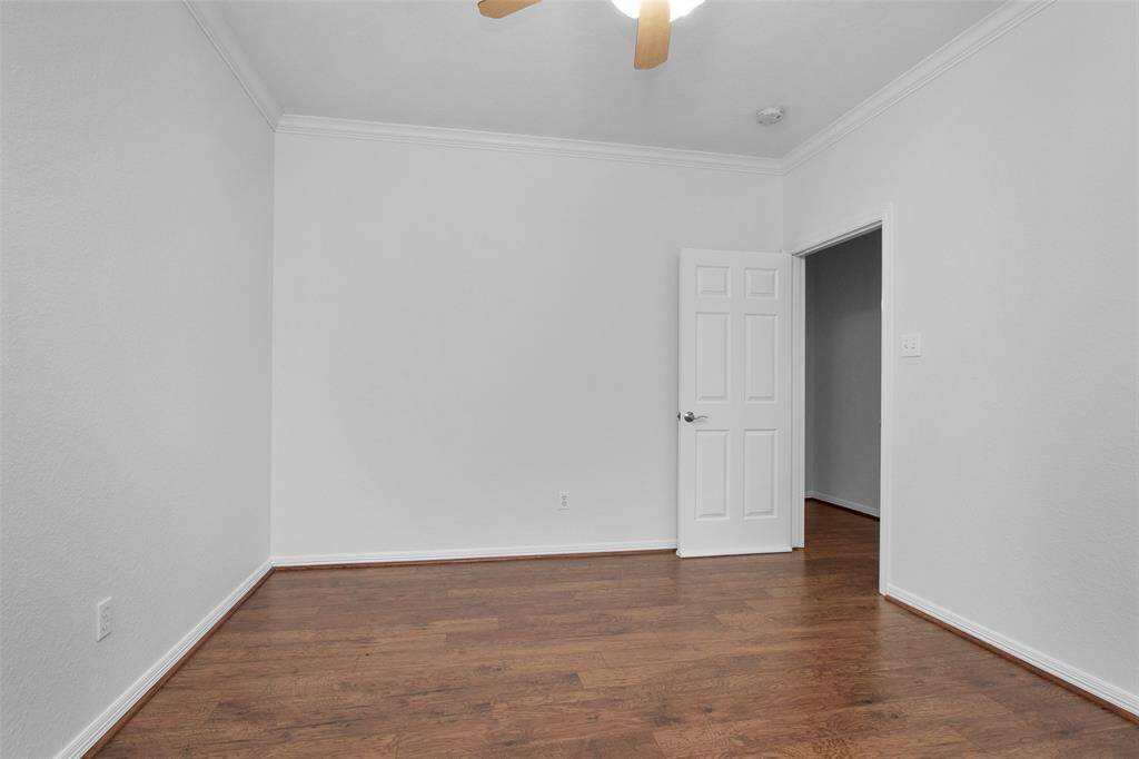 Bedroom 2 with easy clean floors and a walk-in closet.