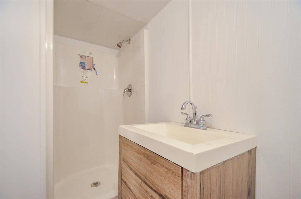 Bathroom located in utility room/flex space.