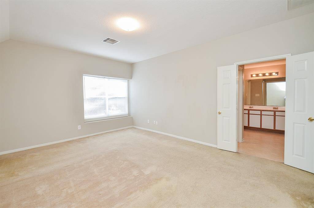 Primary bedroom is upstairs and has an ensuite bathroom and large walk in closet.