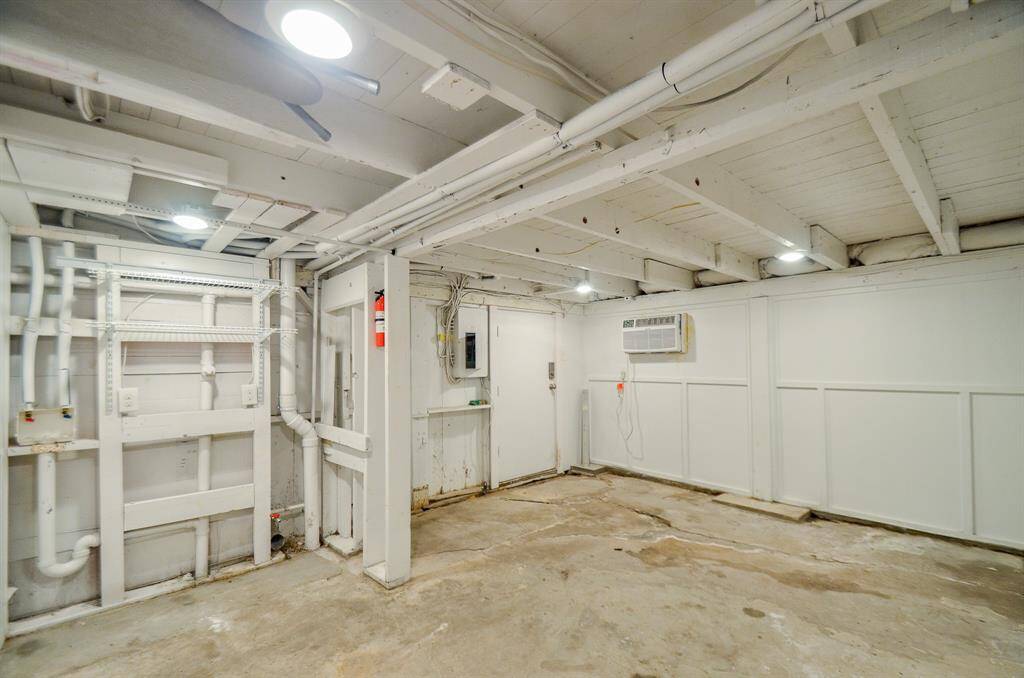 Utility room/flex space located between the covered patio area and garage/workshop. Laundry area has connections for a washer and dryer (both gas & electric).