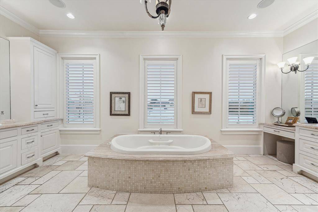 His/Hers sinks with vanity area & cabinet/drawer storage.