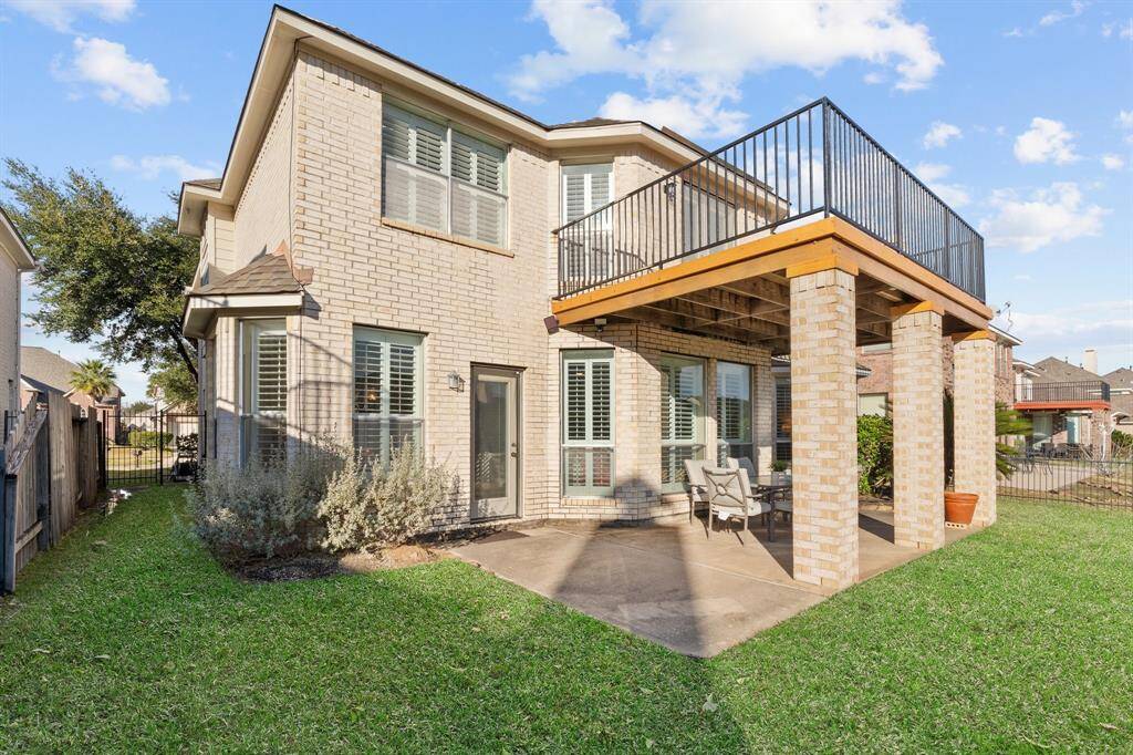 Nice view of the back porch and balcony.