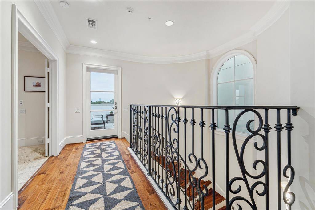 Fourth floor gallery with access to rooftop deck & gameroom/third bedroom.
