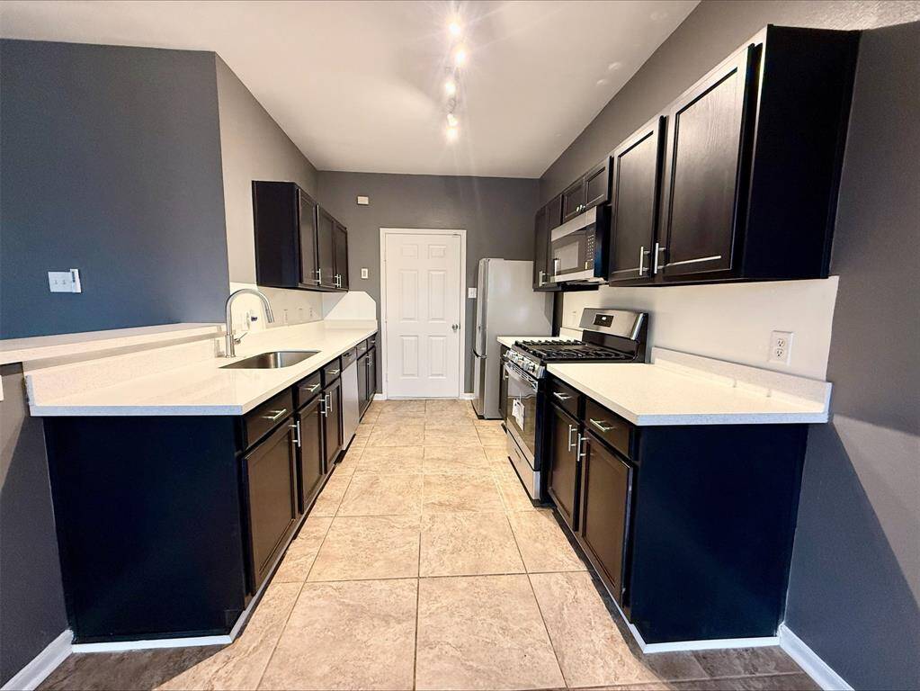 This open-concept kitchen and dining area is a showstopper, with modern appliances, beautifully updated finishes, and a unique charm that combines style with functionality.