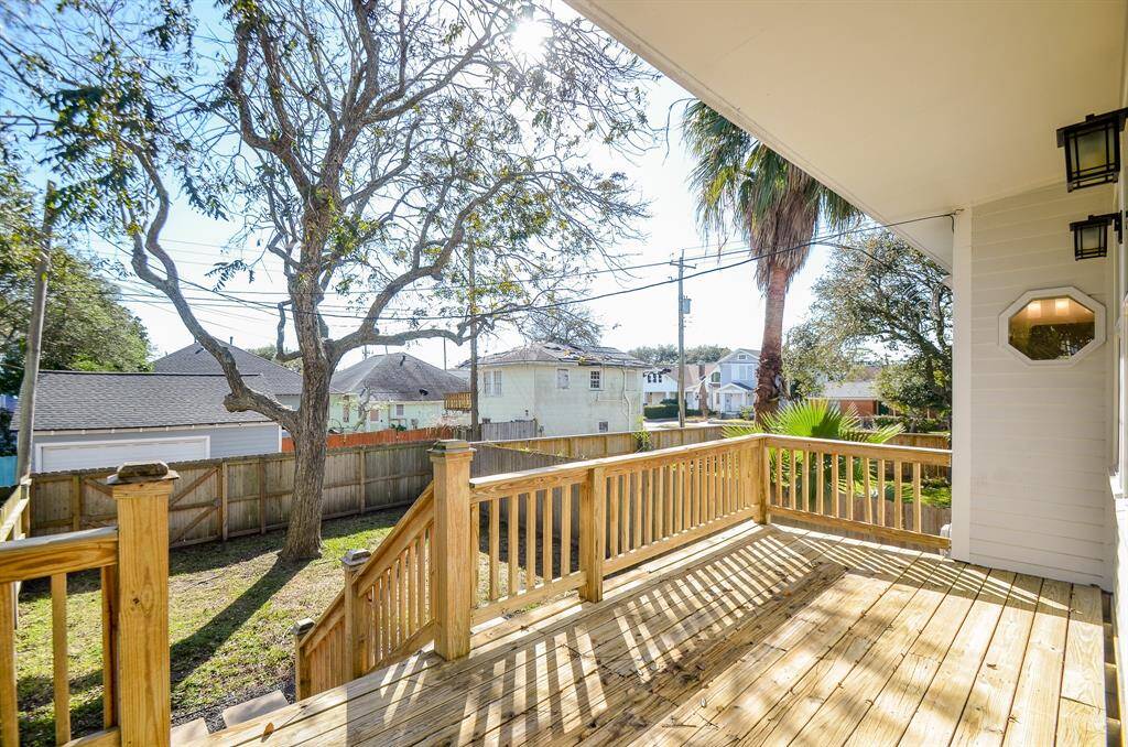 Wrap around rear deck installed in 2021 overlooks the spacious backyard.