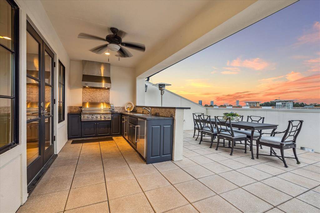 Rooftop deck with expansive views.  Outdoor kitchen with dining area and bar seating.