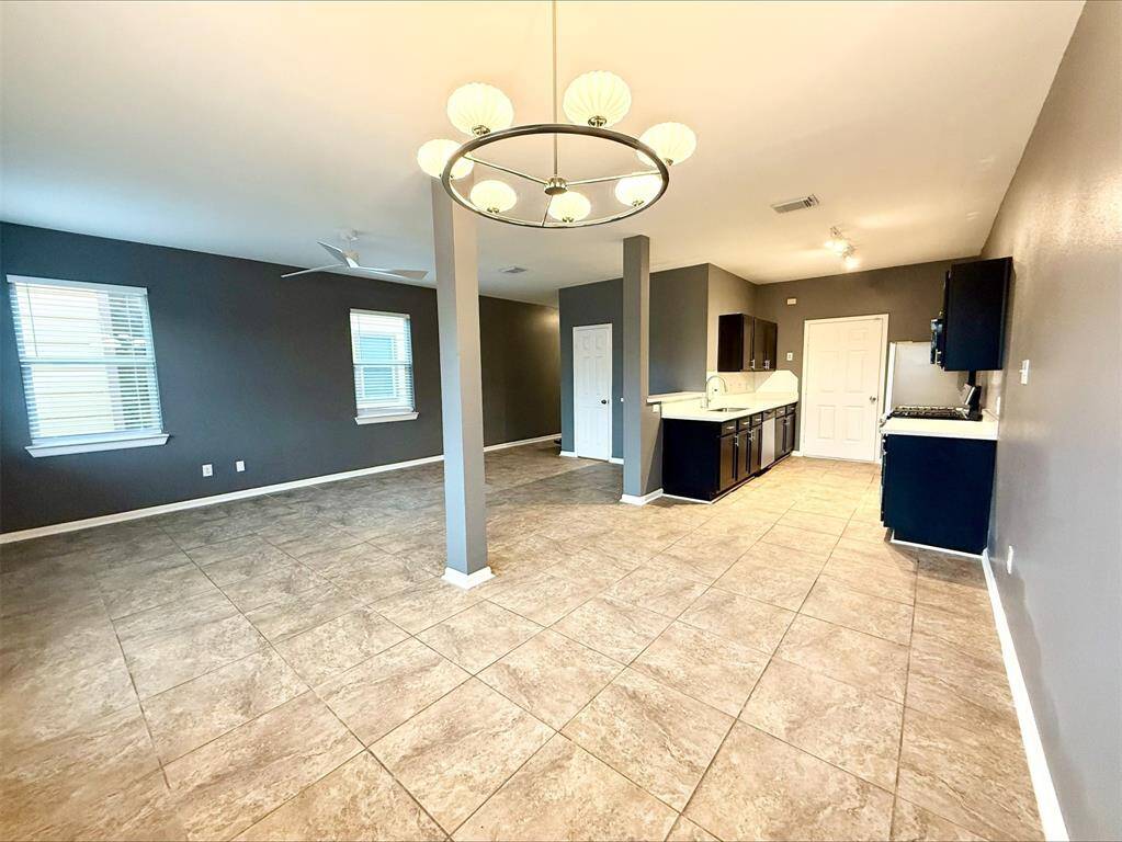 The living room in this unit exudes warmth and coziness, with a layout designed for comfort.