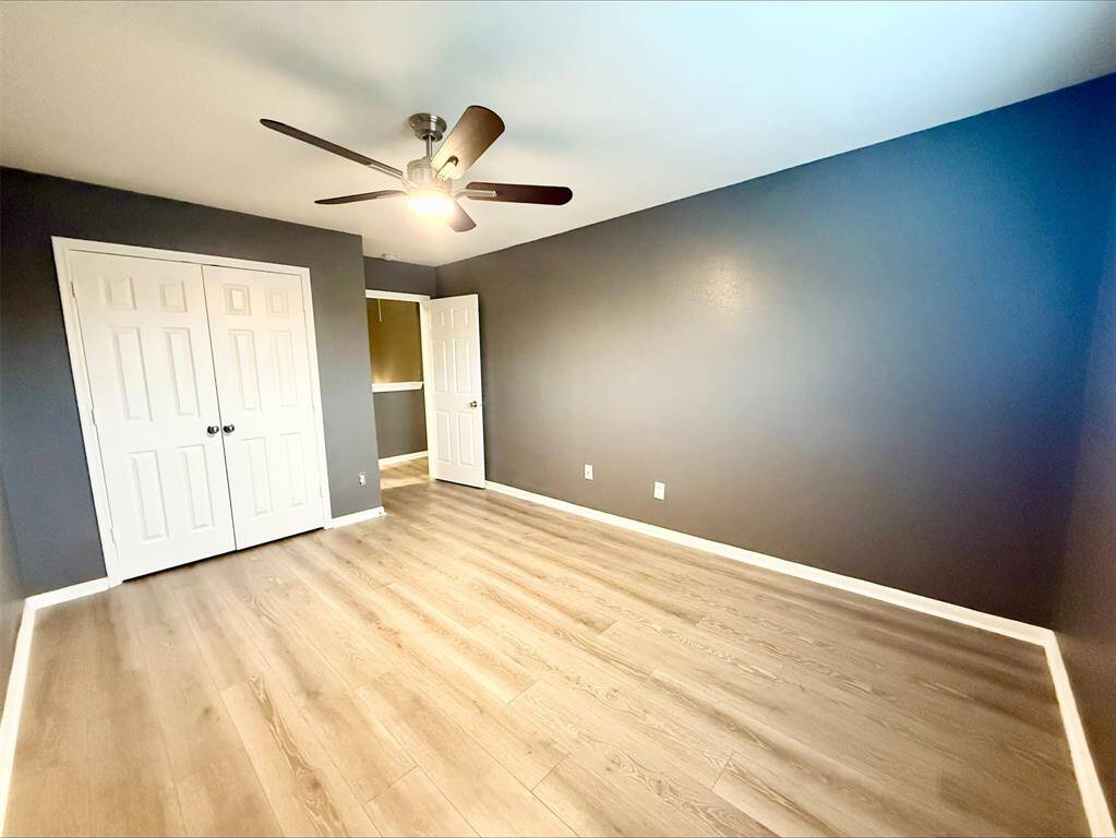 The secondary bedrooms continue the theme of warmth and charm, featuring clean finishes and plenty of natural light. These spaces are versatile and ready to meet any need.