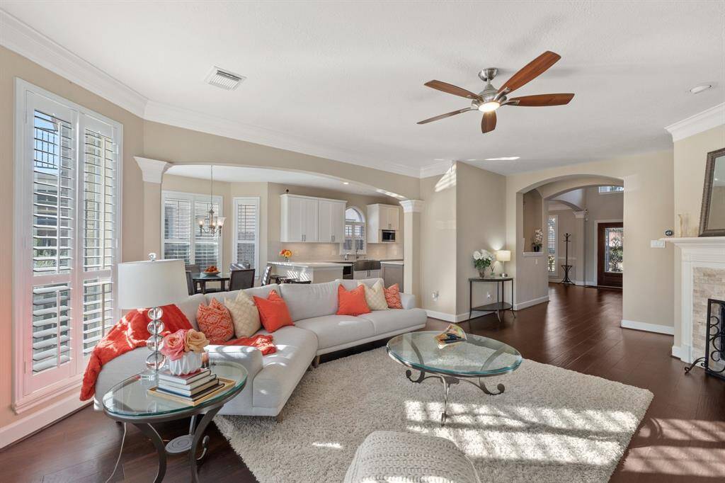 The bright, large family room allows plenty of natural sunlight in.