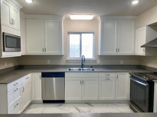 Light and bright kitchen with lots of storage.
