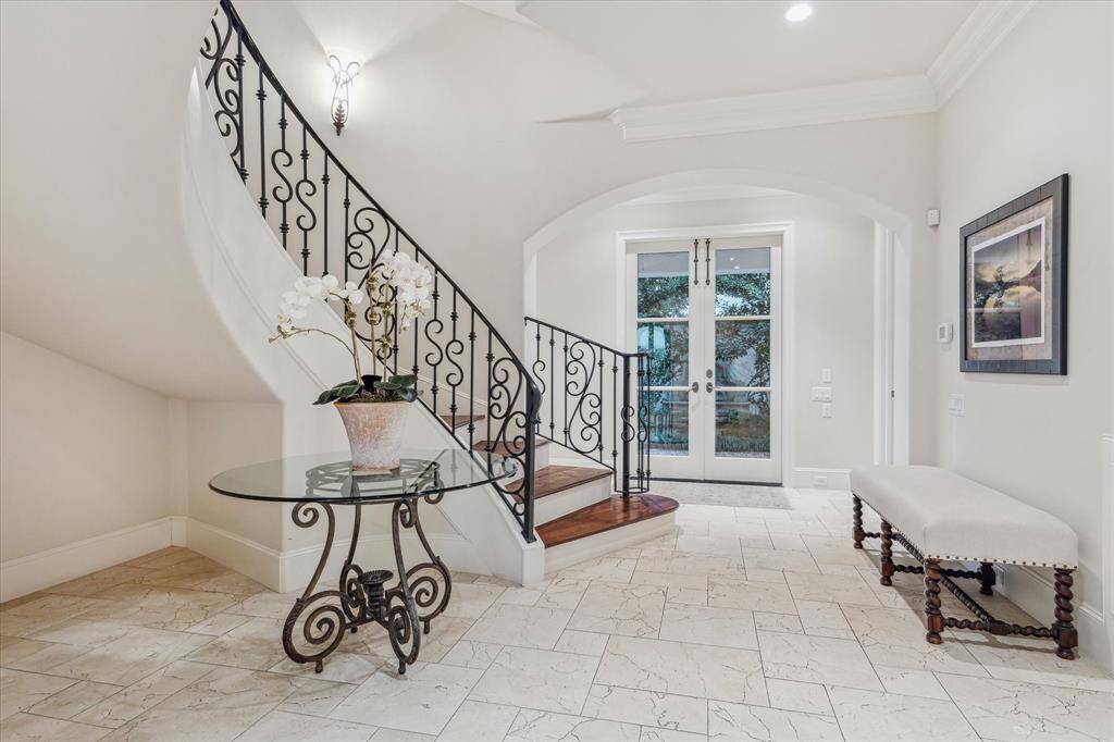 Stair hall with enough space for a baby grand piano.