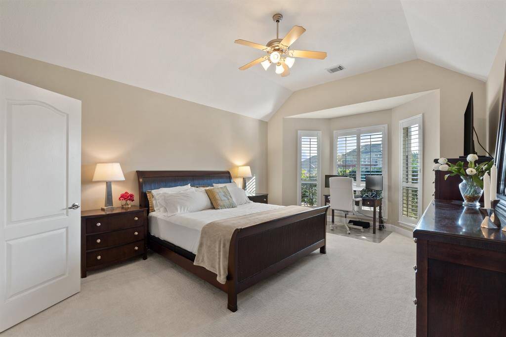 Primary bedroom sits off the back of the home so you can enjoy the water view from the bay window. This space is big enough for large bedroom furniture and a desk.
