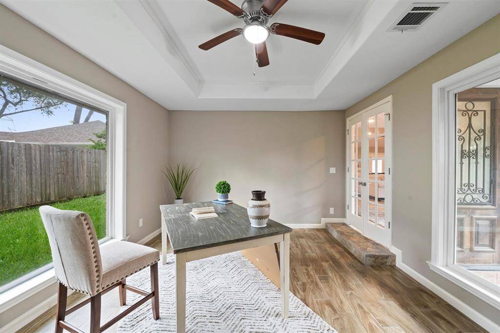 Of the main entryway, lies the home office/study! This spacious area is the perfect place to work from home or create fun hobbies as a creative space.