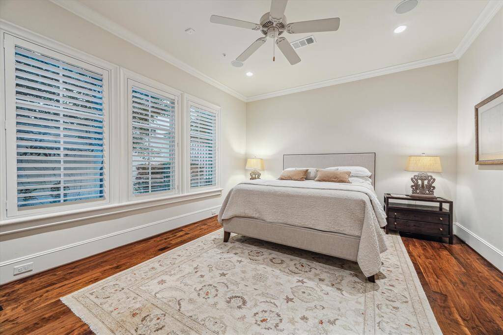 First floor bedroom with private bath and views to beautifully landscaped backyard.