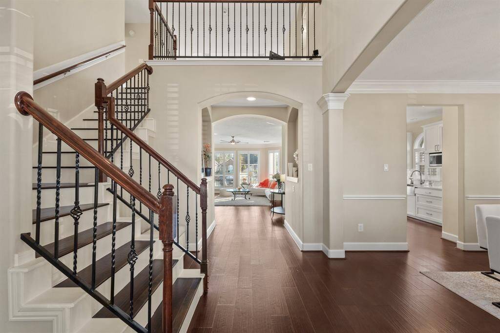 As you enter this home, you have a full view to the back of the home, the Dining room on the right and gorgeous hardwood stairs leading to the upstairs on the left.