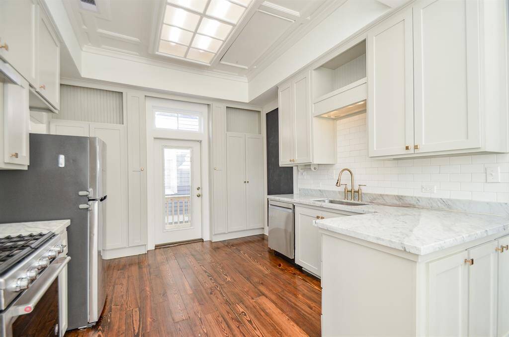 Kitchen was fully updated in 2021 with new cabinets, counter tops & stainless steel appliances. Exterior door gives access from the kitchen to the outdoor deck.