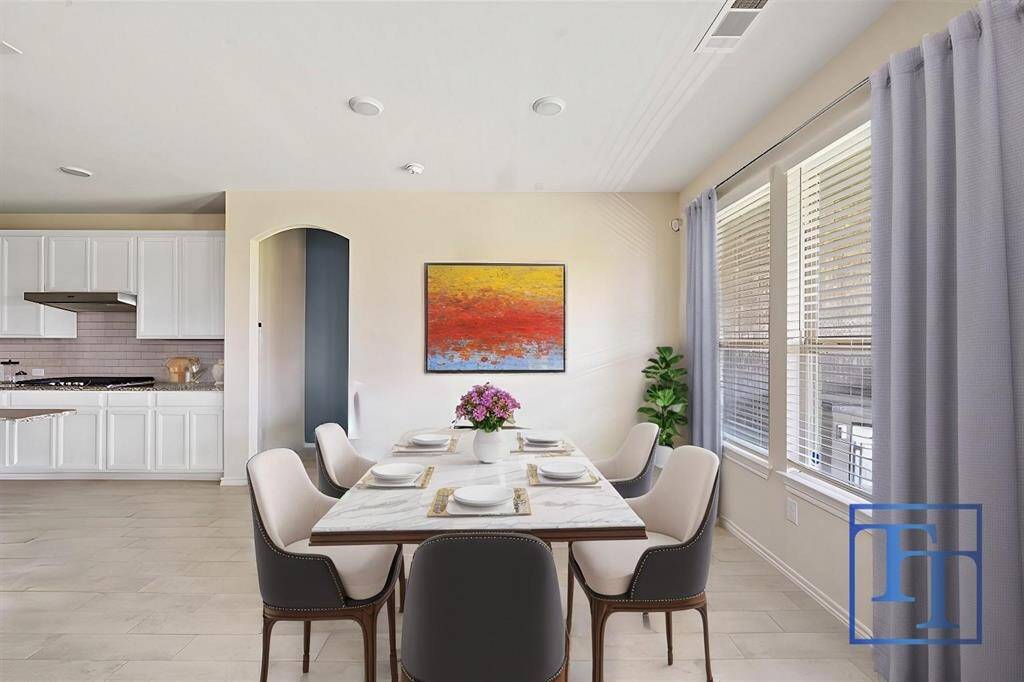 The breakfast nook is situated right off the kitchen for easy conversation and quick meals.