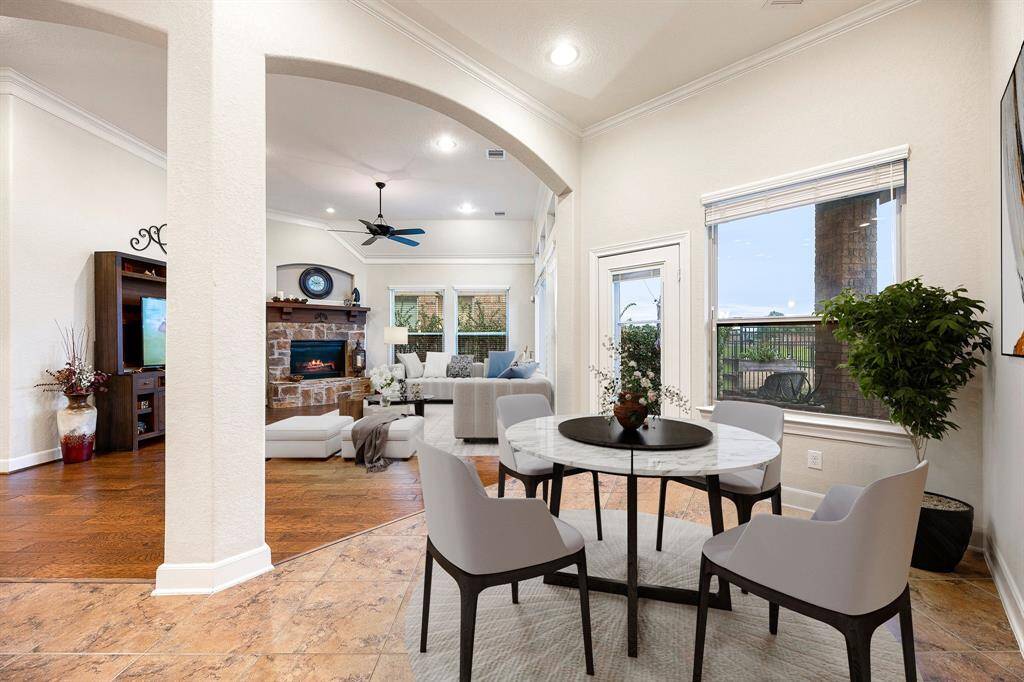 Start your day off right with a cup of coffee sitting with your family in the lovely breakfast area! Featuring large windows with blinds, neutral paint, wood flooring, recessed lighting and high ceilings. *virtually staged*