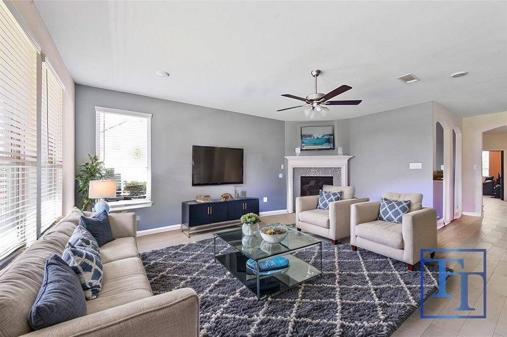 The living room is flooded with tons of natural light thanks to the surrounding windows.