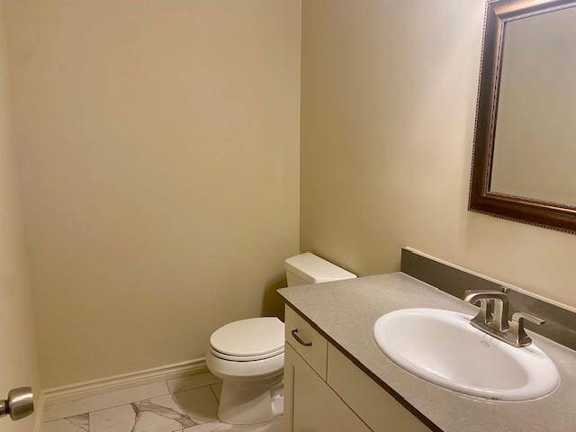 Half bath right of den.