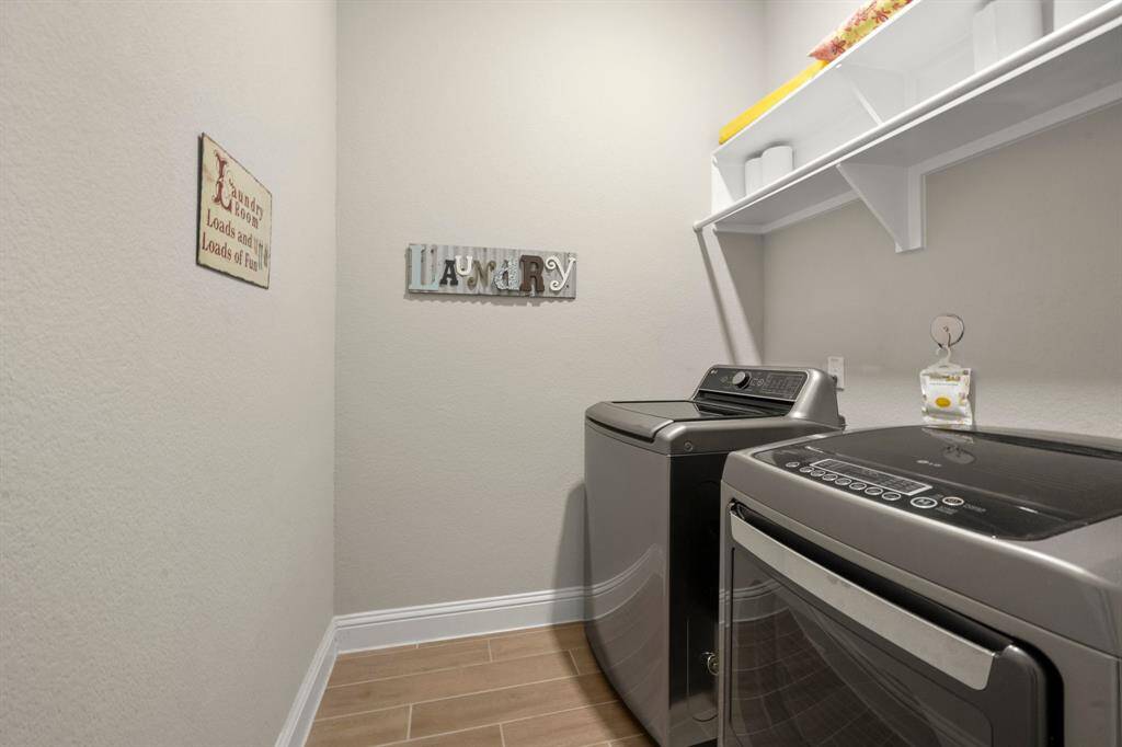 Inside Laundry Room with pull down attic