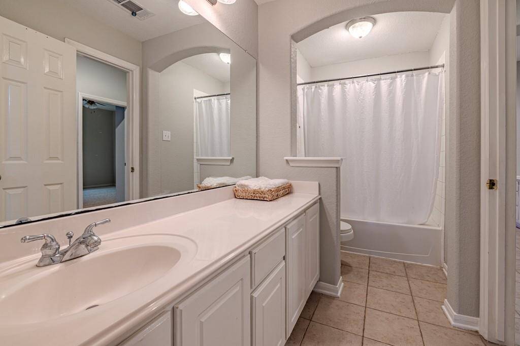Two secondary bedrooms on front half of house with mud room area just off garage