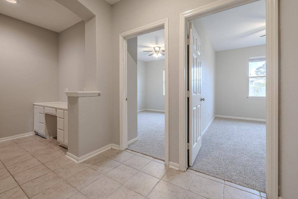 Two secondary bedrooms on front half of house with mud room area just off garage