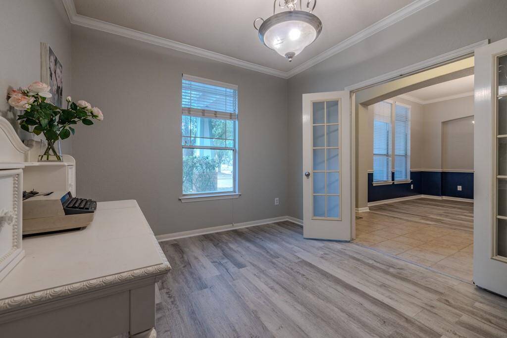 This home office could be a 5th bedroom or media room