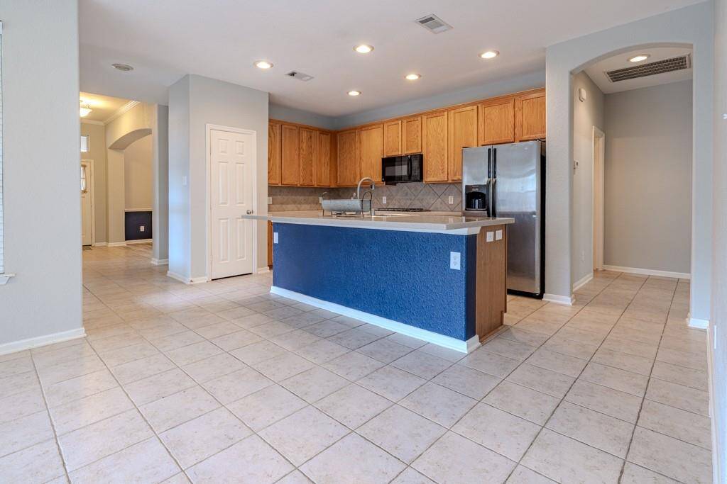 This open concept kitchen is STUNNING with eat in island