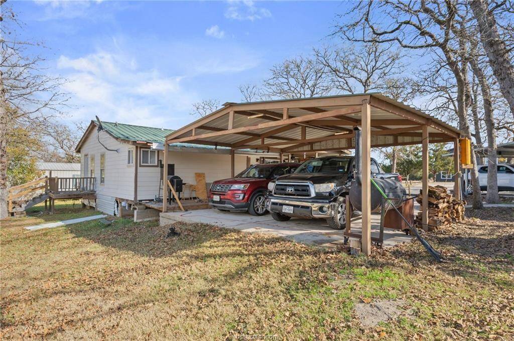 Covered Carport and Concrete drive
