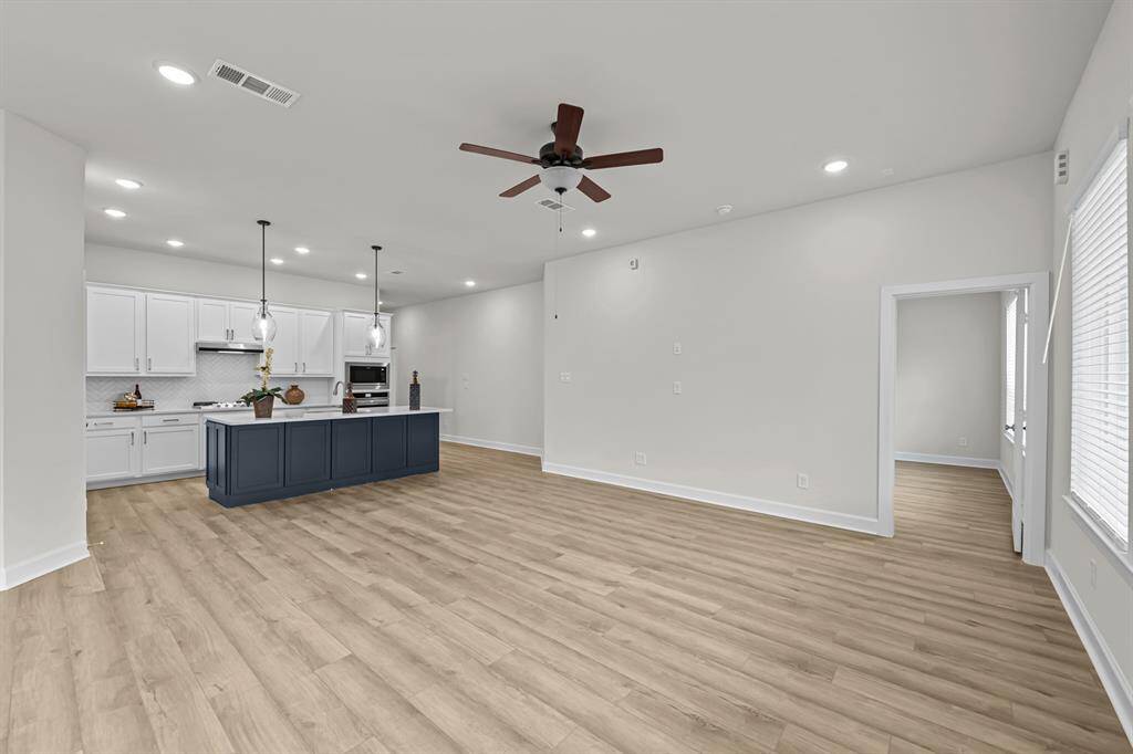 Kitchen overlooks Living area and rear yard!  Great for entertaining friends and family!