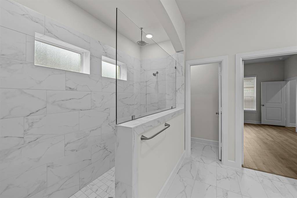 Large walk in Super Shower with rain shower head.