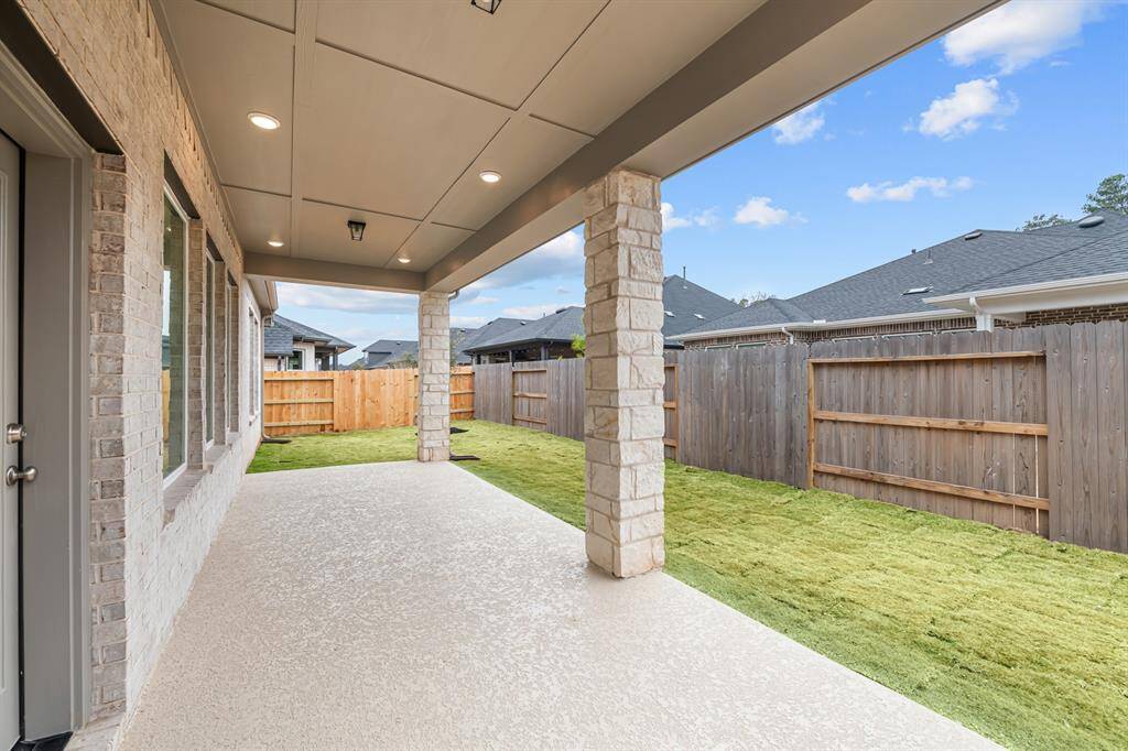 Large rear covered patio is great for relaxing with friends and family!