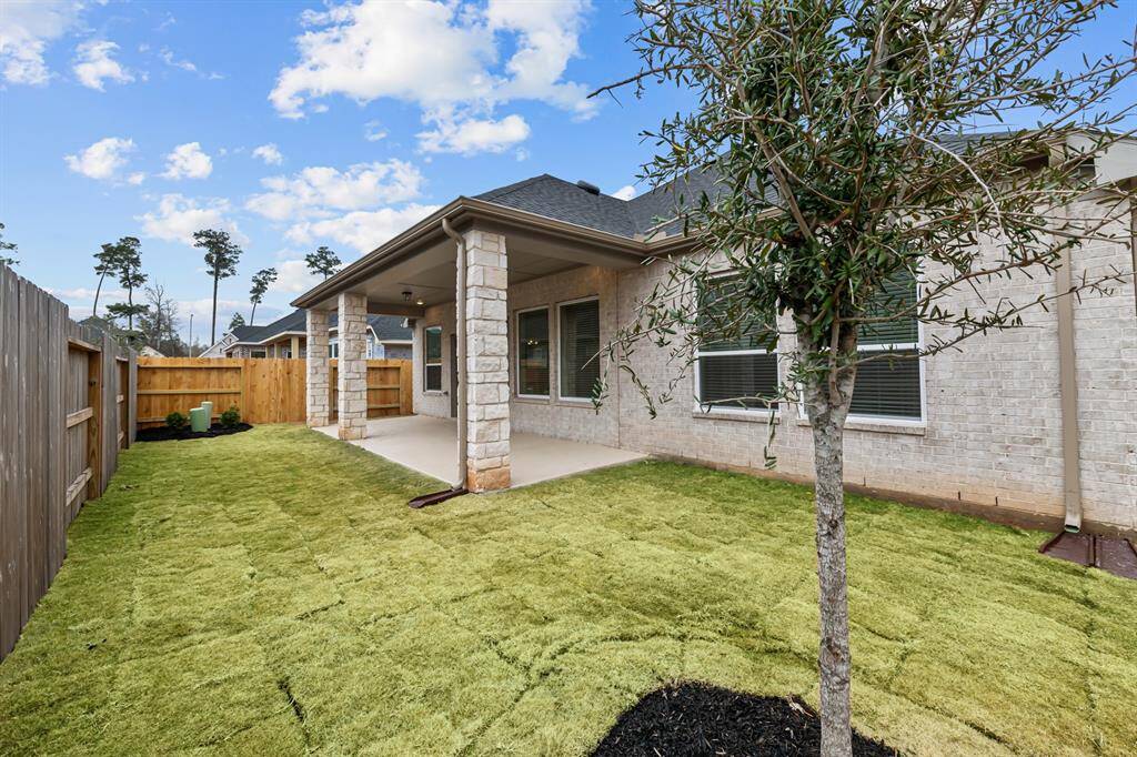 Fully fenced rear yard with gutters around perimeter of home!