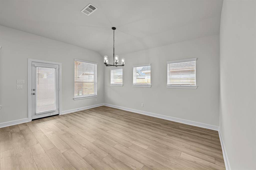 Large dining area!  Window treatments already provided!