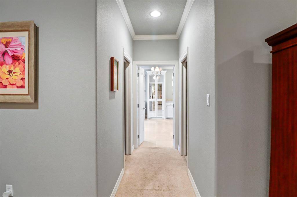 Hallway leading to primary ensuite and 2 walk in closets