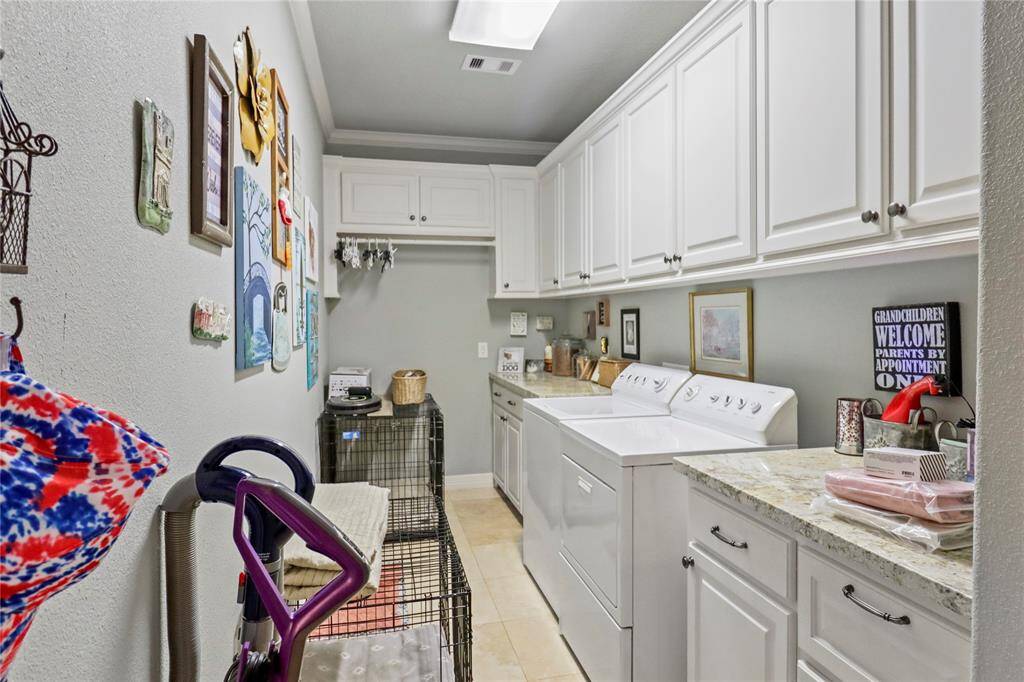 Very large utility with lots of cabinets.  So much room!