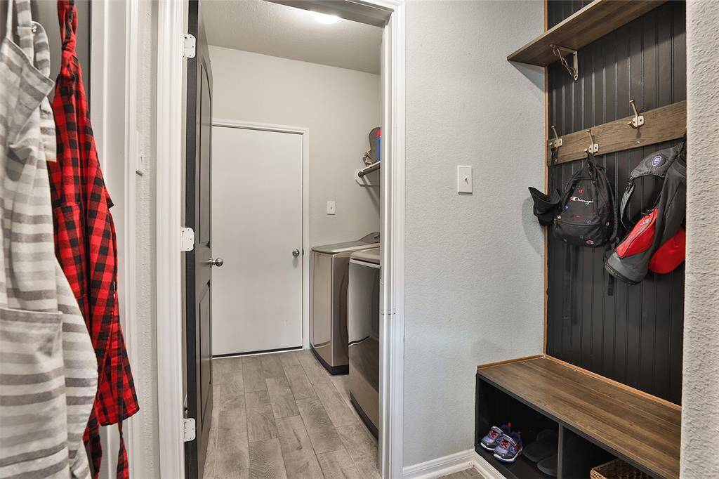 BONUS! A built-in mud space leads to the utility room, offering a convenient area to store items and keep your home free of clutter.
