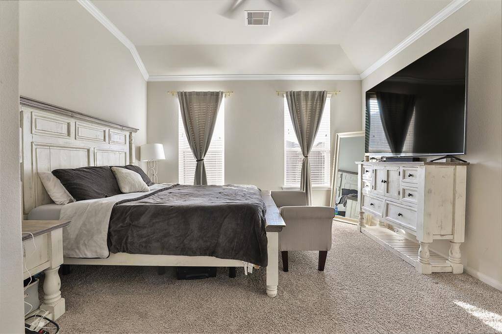 Welcome to the primary bedroom, the only bedroom located downstairs, offering ample privacy and comfort.