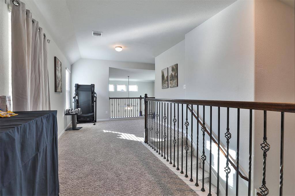 Cross the hall to discover the other secondary bedrooms, each offering comfort and space.