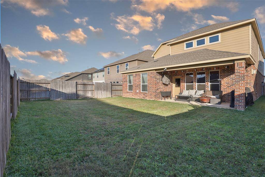 Let’s not forget about the yard—an attached patio that’s perfect for soaking up relaxation.