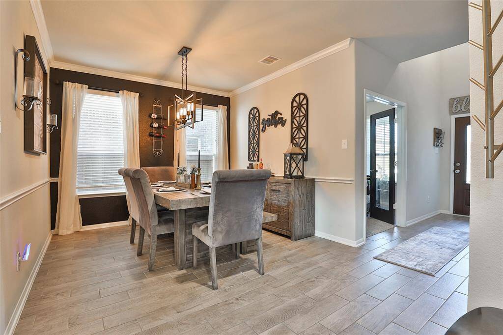 The primary living area downstairs features tile flooring throughout, offering both durability and easy maintenance for a clean and accessible space.