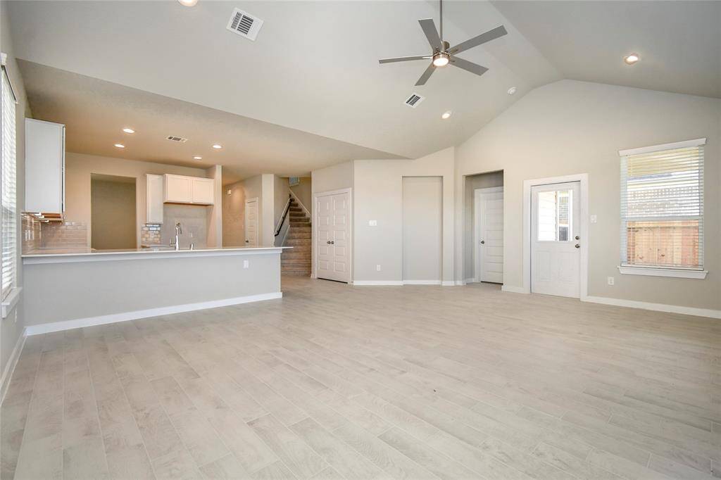 Welcome family and guests to your charming living room!Sample photo of completed home with similar floor plan. Actual colors and selections may vary.