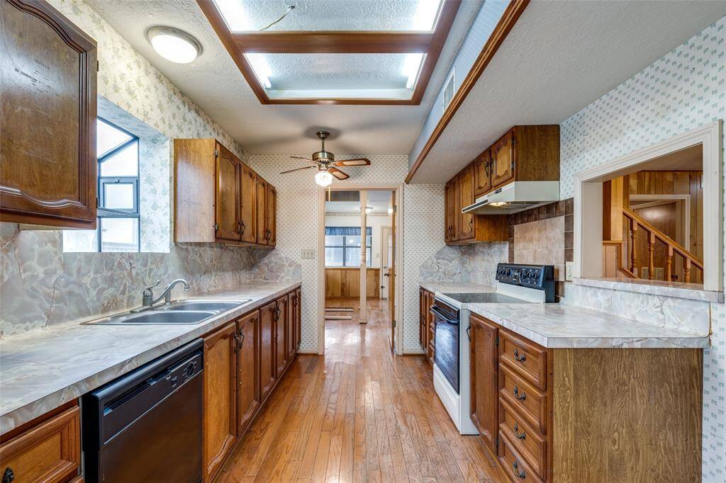 Galley style kitchen with plenty of counter space and cabinets