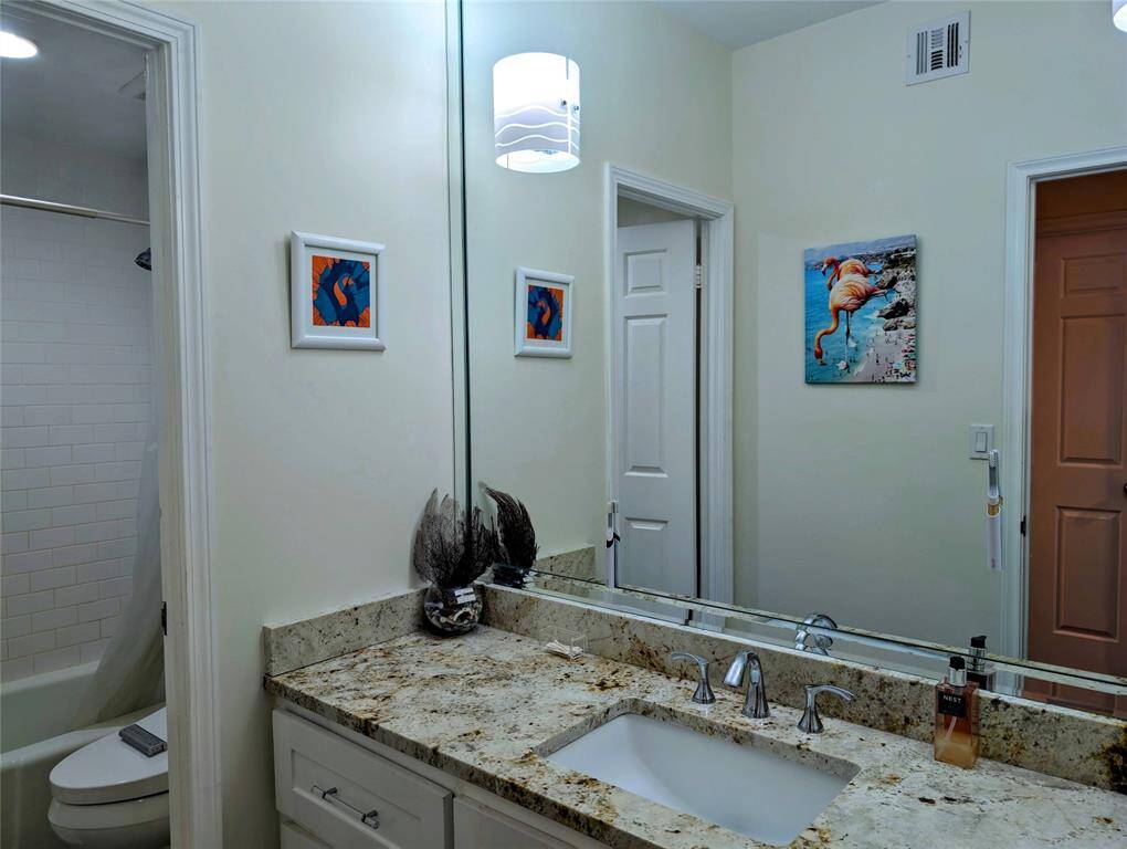 The second bathroom features an electric outlet for a bidet.