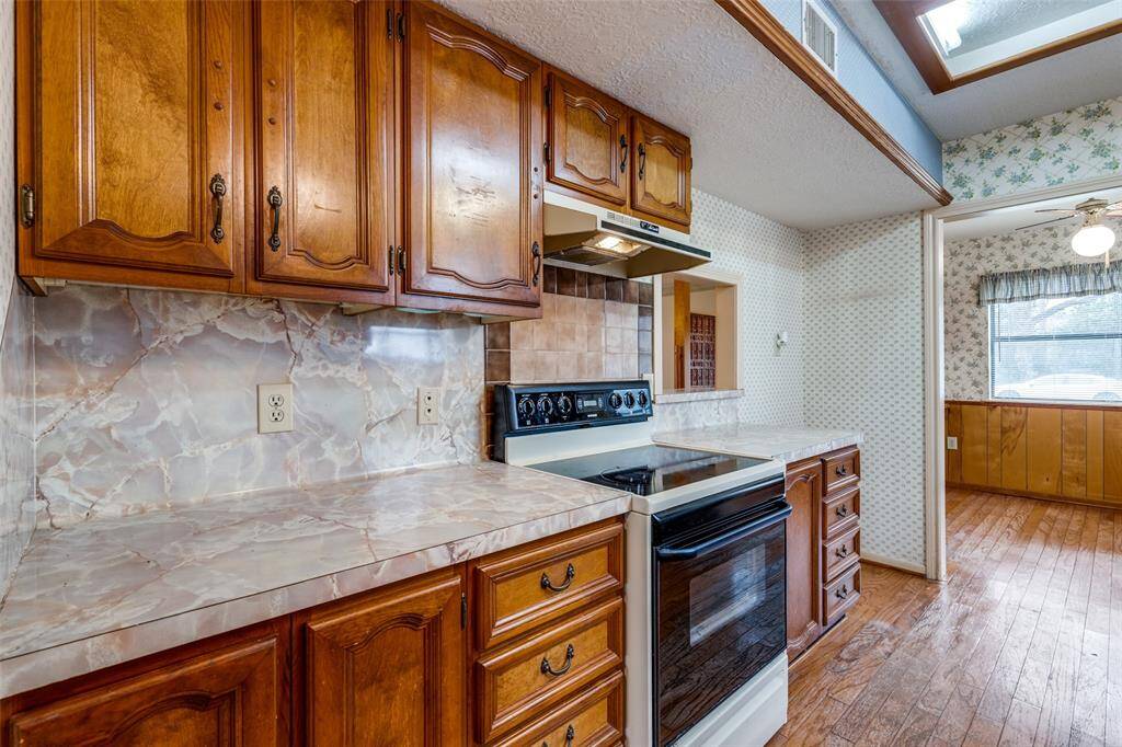 Kitchen opens to breakfast area and pass through window into living room